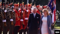 Britain's Prince Charles (left) and Croatian President Kolinda Grabar-Kitarovic inspect a guard of honor during the welcome ceremony for the Prince of Wales in Zagreb on March 14.