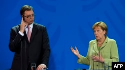 Aleksandar Vučić sa nemačkom kancelarkom Angelom Merkel u Berlinu, jun 2014.