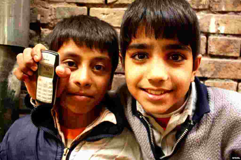 These two young Afghan refugees make a living by carrying heavy goods in the market in Qazvin.