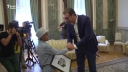 Refugee 'Little Picasso' Gives Portrait To Serbian President