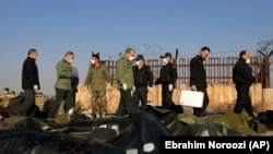 نیروهای امنیتی در سایت سانحه سرنگونی هواپیمای اوکراینی