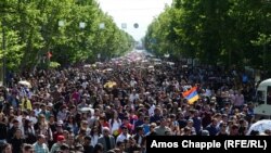 A crowd walks silently up Mashtots Avenue, the site of recent protests, toward the memorial for the victims of the World War I-era massacre.