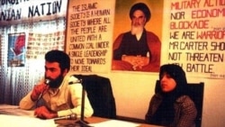 Hossein Sheikholeslam (L) who was one of the students who occupied the US embassy in Tehran, sitting close to Massoumeh Ebtekar in a press conference at the embassy, undated.