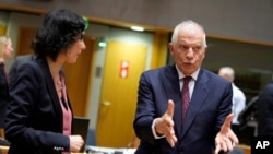 European Union foreign policy chief Josep Borrell, right, speaks with Belgium's Foreign Minister Hadja Lahbib during a meeting of EU foreign ministers in Brussels, January 22, 2024. 