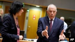 Watched by Belgian Foreign Minister Hadja Lahbib (left), EU foreign policy chief Josep Borrell speaks at a meeting of EU foreign ministers in Brussels on January 22. 