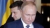 Ukrainian President Volodymyr Zelenskiy stands behind Russian President Vladimir Putin after they met face-to-face for the first time at talks in Paris on December 9 aimed at ending the conflict in eastern Ukraine.