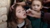 Вакцинация, обязательная или добровольная, проводится во многих странах. На снимке – вакцинация в Кветте, Пакистан, январь 2017