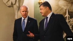 Ukrainian President Petro Poroshenko (right) talks with U.S. Vice President Joe Biden during a meeting in Kyiv in December 2015.