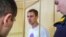 A prison guard arrested in connection with a case involving the alleged torture of prisoner Yevgeny Makarov is shown in court on July 25.