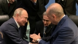 Recep Tayyip Erdogan (sağda) və Vladimir Putin Liviyaya dair Berlin konfransında