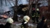 Lithuanian rescuers work next to the wreckage of a cargo plane following its crash near the Vilnius airport on November 25.