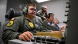 NATO surveillance operators work on computers aboard a surveillance aircraft during a flight over Polish airspace as part of the alliance's new Eastern Sentry mission on September 19. 