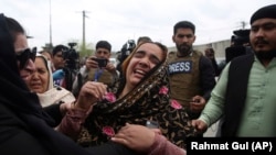 Family members cry after an attack by the Islamic State-Khorasan (IS-K) on a Sikh Gurdwara killed 25 worshippers on March 25, 2020.