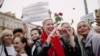 Mayya Kalesnikava interacts with fellow demonstrators at a rally on August 29, 2020.