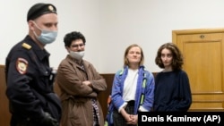 Staff members of the student journal Doxa wait for a court session in Moscow earlier this year after their publication was raided by authorities.