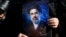 A woman in Tehran on March 9 holds a portrait of Iran's new supreme leader, Mojtaba Khamenei, at a gathering to support his appointment amid the US-Israeli war with Iran.