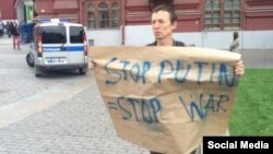 Pictures such as this one of a lone man protesting against Russia's invasion of southeast Ukraine in Moscow on August 28 have been doing the rounds on social media