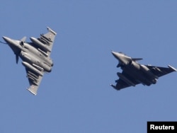 A file photo of French Rafale fighter jets above Corsica in March 2011.