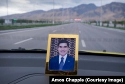 A portrait of Berdymukhammedov on the dashboard of a taxi. The trained dentist runs one of the most repressive regimes on Earth and has continued the cult of personality that was begun by his predecessor, Saparmurat Niyazov, since taking power in 2007.