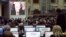 Журналисты в пресс-центре смотрят трансляцию выступления Владимира Путина