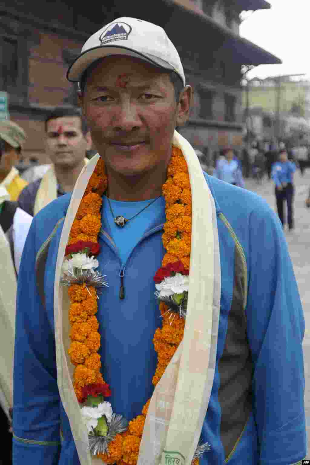 Nepalese mountaineer Phurba Tashi Sherpa, who has summitted Everest a record 21 times, takes part in the Diamond Jubilee celebrations. 