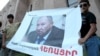 Armenia - Youth activists hold up a banner demanding the resignation of Henrik Navasardian, Yerevan's public transport chief, 28Jul2013 