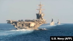 The aircraft carrier USS Abraham Lincoln in the foreground (file photo)