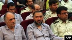 Former Vice President Mohammad Ali Abtahi (center) is among the defendants on trial.