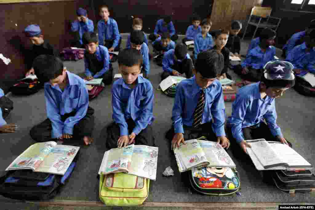 Pakistani boys attend school a day ahead of International Literacy Day in Peshawar. International Literacy Day is observed on September 8 each year. This year&#39;s theme is Literacy And Health. (epa/Arshad Arbab)