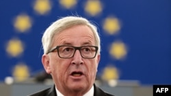 European Commission President Jean-Claude Juncker announces a quota plan for refugees as he makes his State of the Union address to the European Parliament in Strasbourg on September 9.