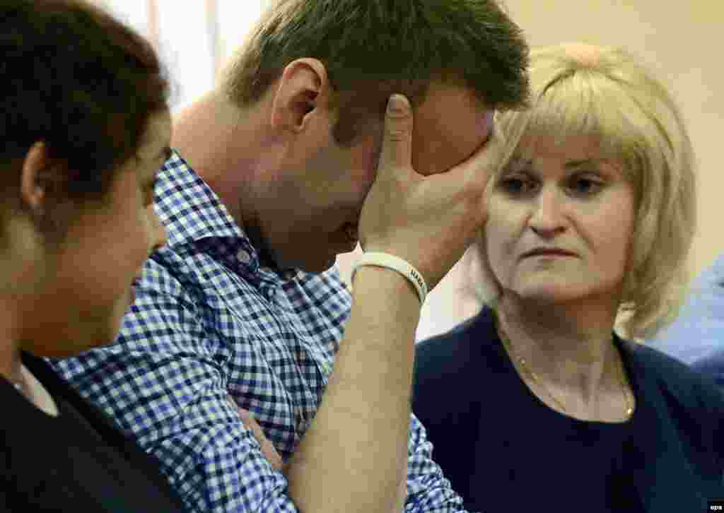 Russian opposition figure Aleksei Navalny reacts as the judge reads his sentence.