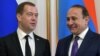 Armenia -- Russian Prime Minister Dmitry Medvedev (L) and his Armenian counterpart Ovik Abrahamyan arrive to hold a joint press conference following their talks in Yerevan on April 7, 2016.