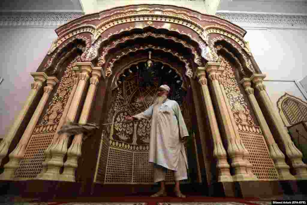 A man cleans a mosque ahead of the Muslim holy fasting month of Ramadan in Peshawar, Pakistan, on May 5. (epa-EFE/Bilawal Arbab)