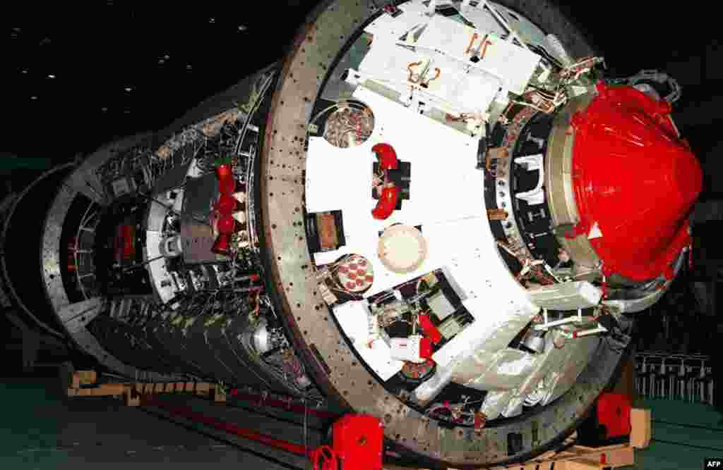 This January 1998 photo shows the very first element of what would later become the International Space Station -- the "Zarya" cargo module -- as the module is prepared for shipment from its Moscow factory to the launch site in Kazakhstan.