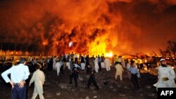 Flames rise from the Marriott hotel following a powerful bomb blast in Islamabad in 2008.
