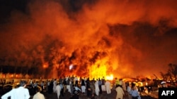 Flames rise from the Marriott hotel following a powerful bomb blast in Islamabad in 2008.