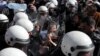 SERBIA -- Bosko Obradovic, leader of the Dveri political party, reacts between riot police shields, at a protest against Serbian President Aleksandar Vucic and his government in front of the presidential building in Belgrade, March 17, 2019