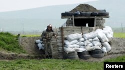 Nagorno-Karabakh -- An ethnic Armenian soldier stands guard at a checkpoint near Nagorno-Karabakh's town of Martuni, April 8, 2016