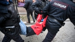 Russian policemen detain a protester during a rally against constitutional reforms in Moscow on January 19.
