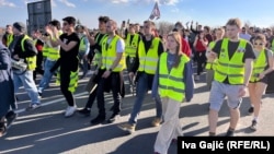 Students march towards Novi Sad, where a concrete canopy collapsed killing 15 people almost three months ago.