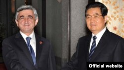 Armenian President Serzh Sarkisian (left) and his Chinese counterpart, Hu Jintao, meet in Shanghai on May 3.