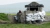 Nagorno-Karabakh -- An ethnic Armenian soldier stands guard at a checkpoint near Nagorno-Karabakh's town of Martuni, April 8, 2016