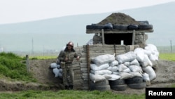 Nagorno-Karabakh -- An Armenian soldier stands guard at the checkpoint near Nagorno-Karabakh's town of Martuni, April 8, 2016