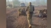 A soldier from Ukraine's 7th Rapid Response Corps walking behind a ground drone in footage released on November 4 from the eastern city of Pokrovsk.