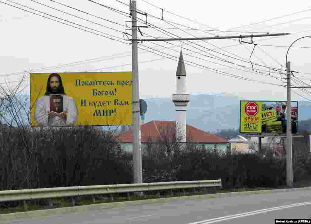 A Christian message, a mosque, and an anti-Maidan billboard (&#39;No to foreign interference!&#39;) on the road from Simferopol to Yalta.