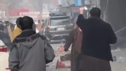 People react after a blast at a Chinese-run hotel restaurant in he Afghan capital, Kabul, on January 19. 