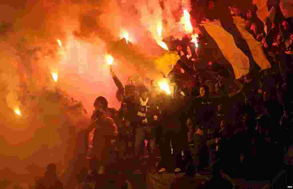 ...while their fans celebrated wildly in the stands...