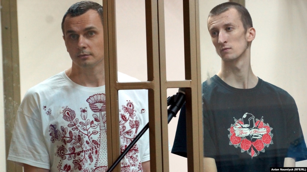 Ukrainian filmmaker Oleh Sentsov (left) and his co-defendant Oleksandr Kolchenko on trial in a Russian court in 2015.