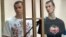 Ukrainian filmmaker Oleh Sentsov (left) and his co-defendant Oleksandr Kolchenko on trial in a Russian court in 2015. 