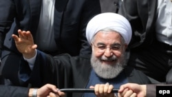 Iranian President Hassan Rohani greets supporters in the southeastern city of Kerman last month. Some have suggested the publication of the pay slips is an attack on him ahead of next year's presidential election.